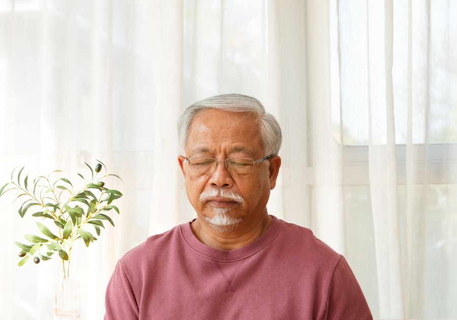 elderly man with his eyes closed