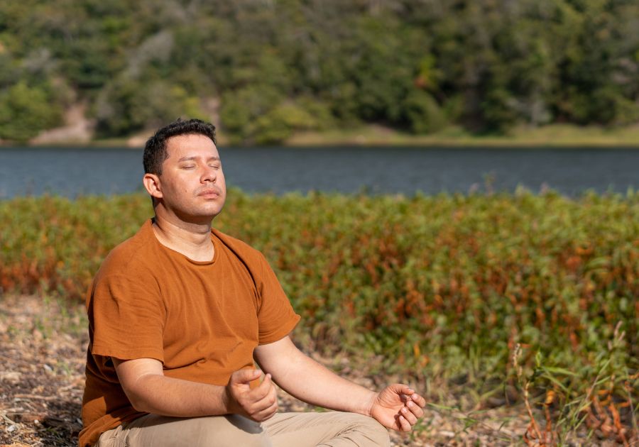man meditating in nature