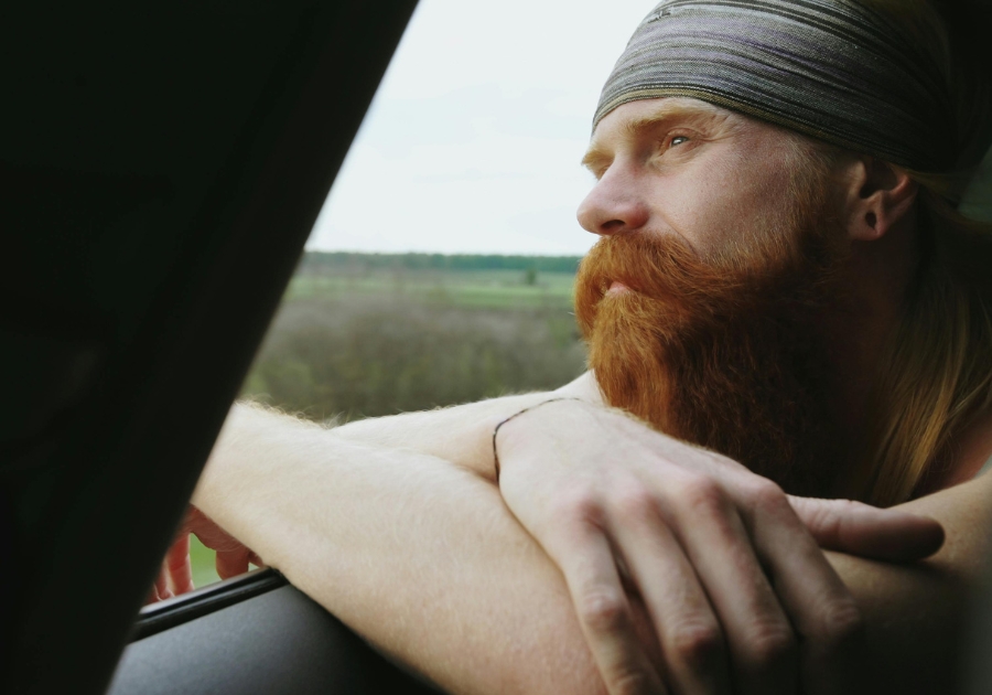 sad man looking out of window